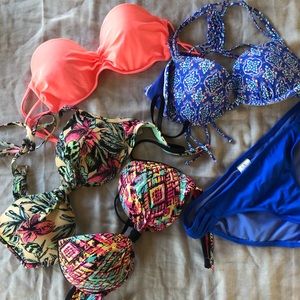 Multiple bathing suit tops and one bottom